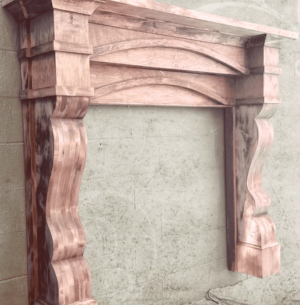 A fireplace mantle with a wooden frame on it.