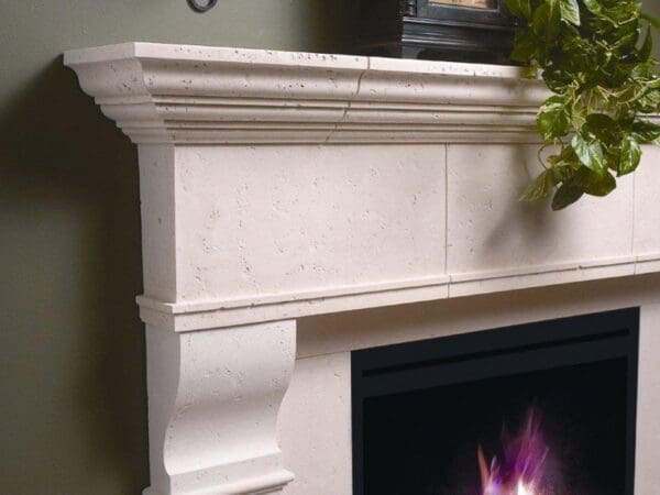 A fireplace with a white mantle and a black fire place.