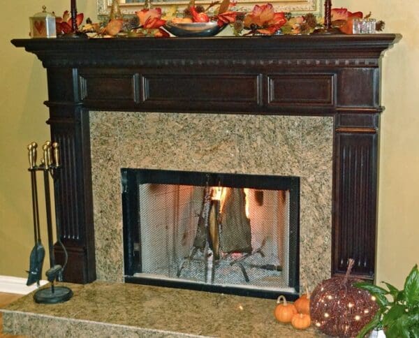 A fireplace with a fire burning in it.