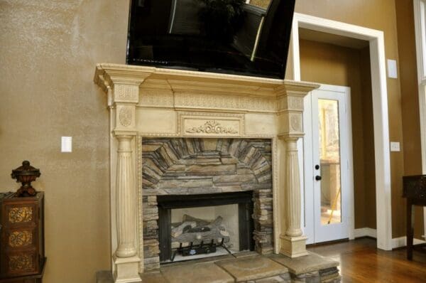 A fireplace with a television mounted on it