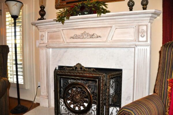 A fireplace with a fire place in the background.