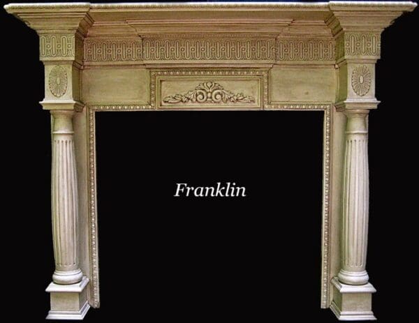 A fireplace with pillars and carvings on it.