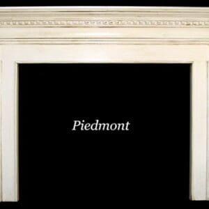 A white fireplace with the name piedmont written in front of it.