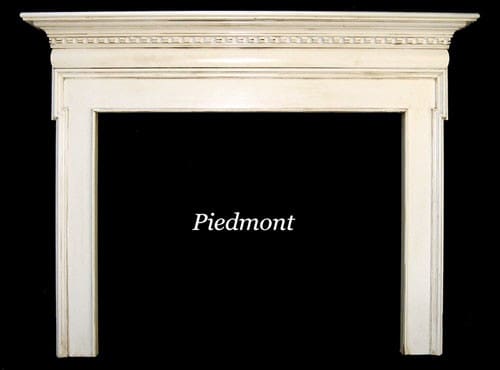 A white fireplace with the name piedmont written in front of it.