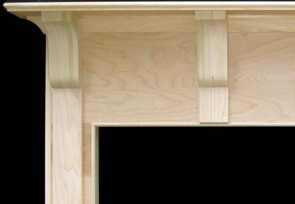 Unfinished wood fireplace mantel.