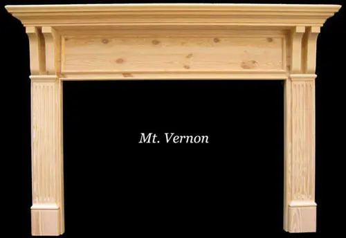 Wooden fireplace mantel with fluted columns.