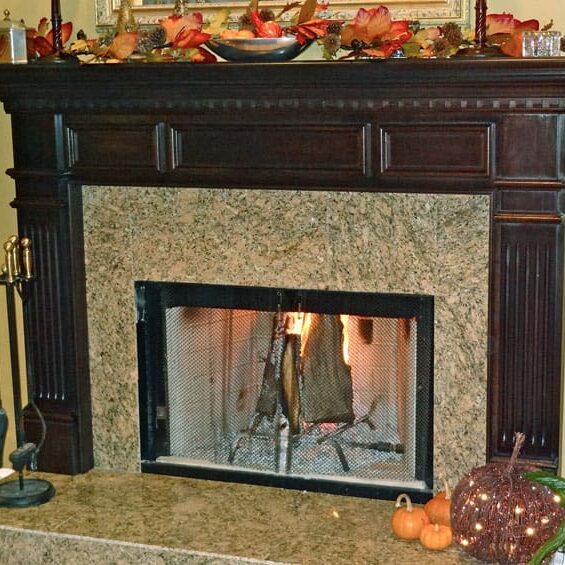 Fireplace with burning logs and decorations.